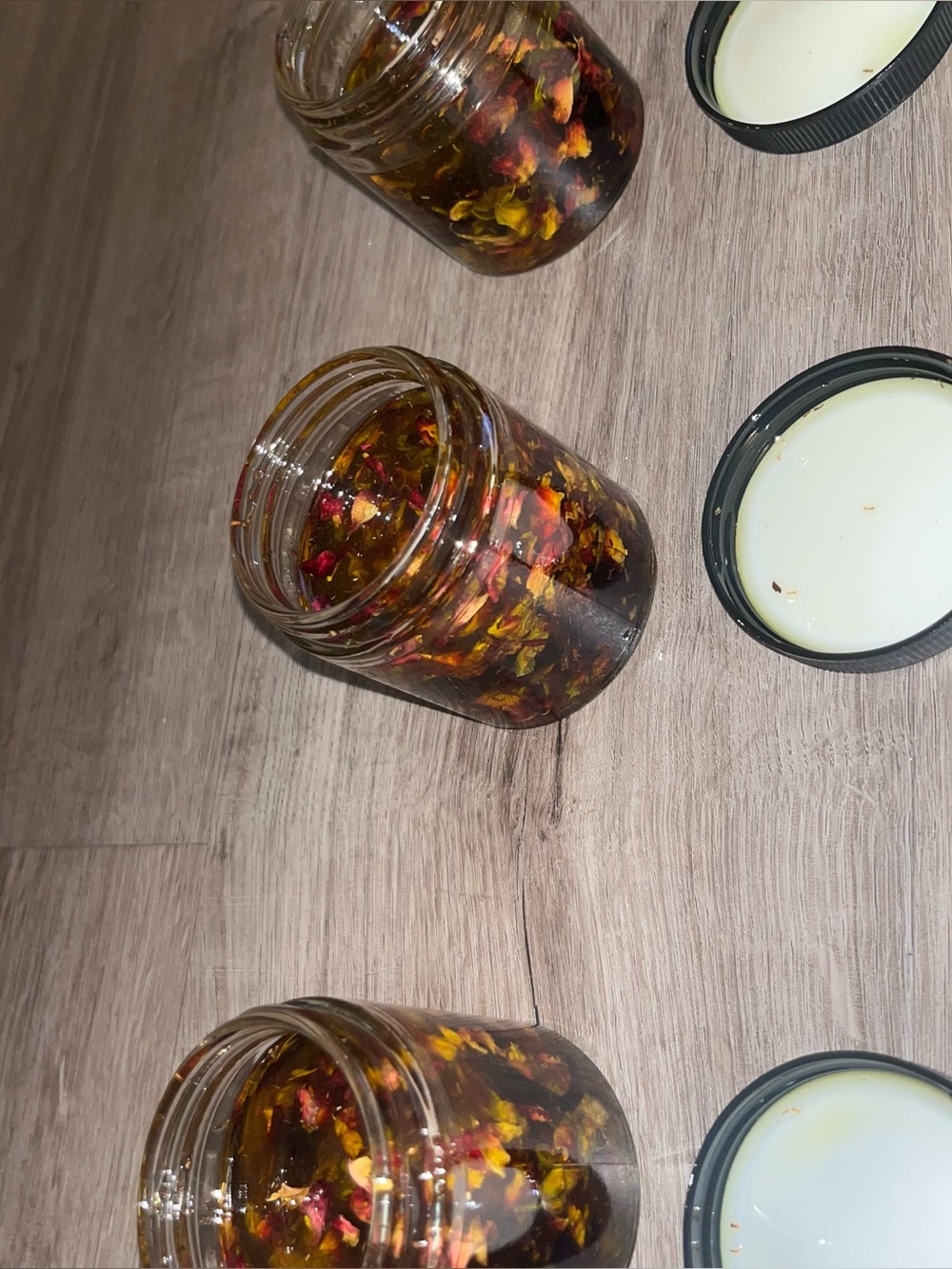 Olive oil infused with rose petals and hibiscus leaves
